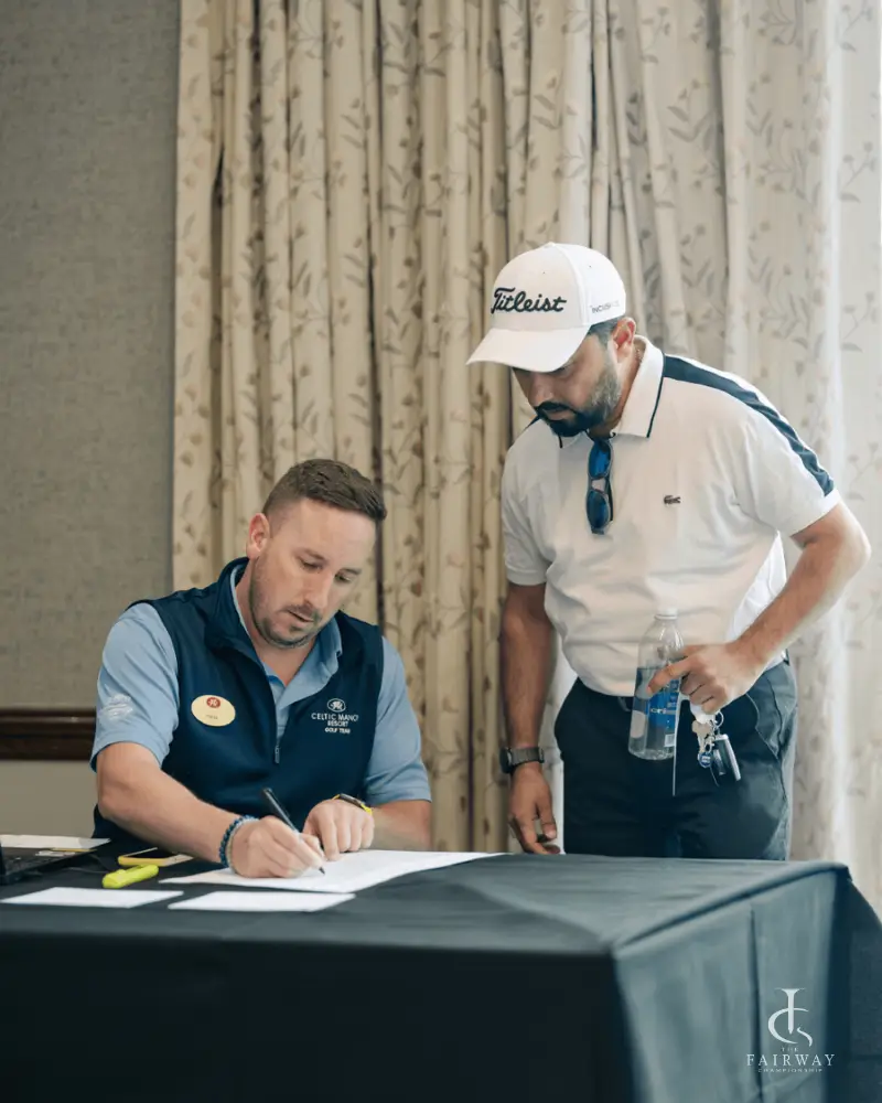 Player signing in at the registration desk at Fairway Championship 2026