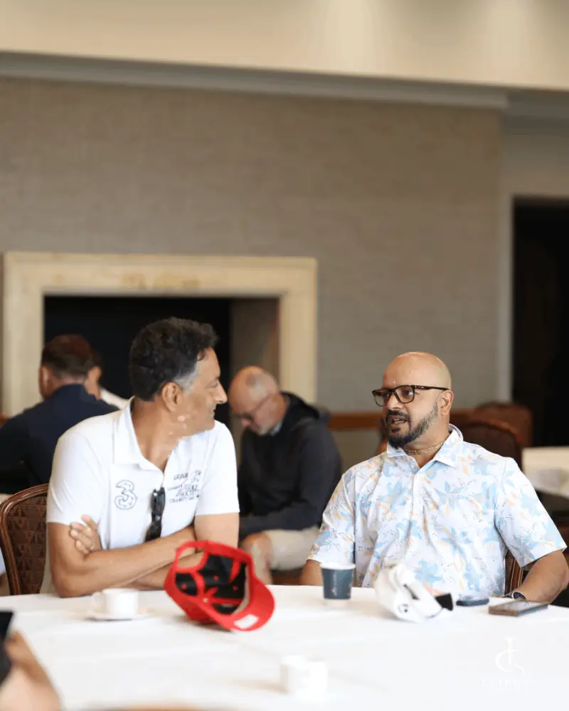 Players seated in conversation at Fairway Championship 2026 registration